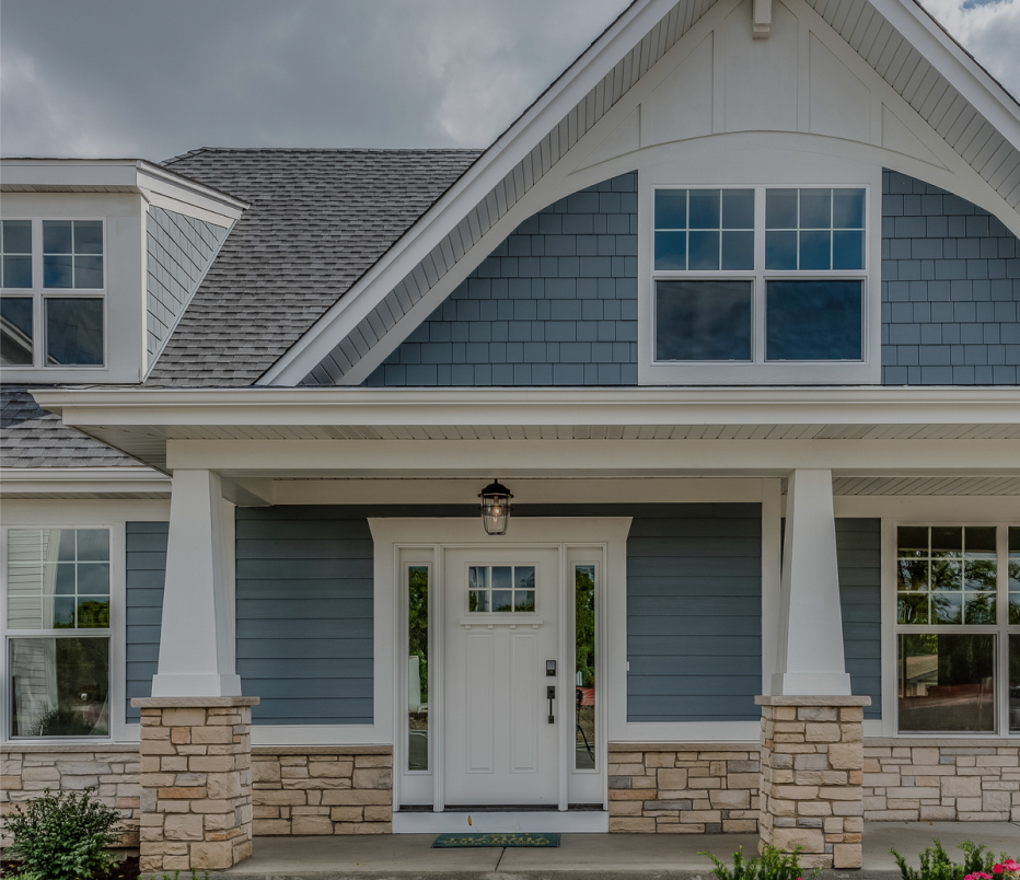 suburban home with blue vinyl siding in VA