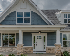 suburban home with blue vinyl siding in VA
