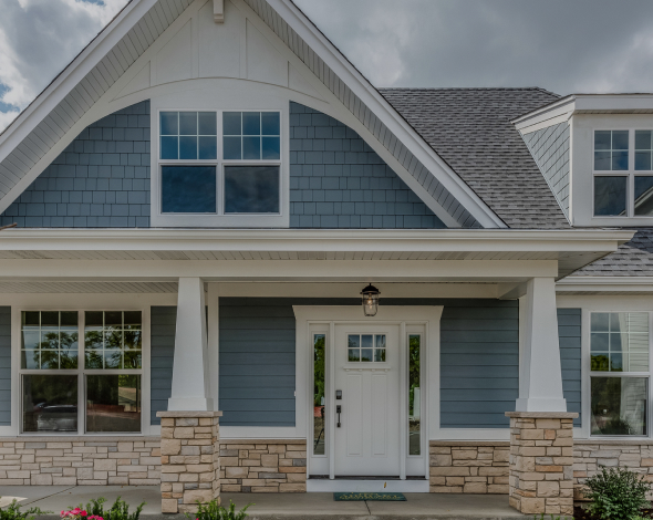 suburban home with blue vinyl siding in VA